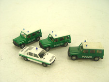 4  Stck. Polizei Fahrzeuge  -