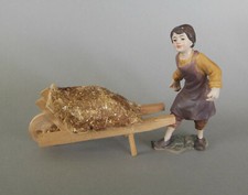 Bauer mit Schubkarren Karren