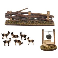 Ziegen an Feuerstelle Zaun