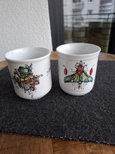 2 FEINKOST KÄFER ,München Haferl , Kaffeebecher  v.  Rupert Stöckl 