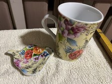 blumig bunte hohe Tee-Tasse mit Teebeutel-Ablage „Nana“, gebr.
