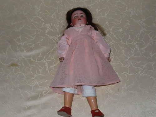 Antike puppe mit rosa - antike,