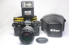 Nikon FG Filmkamera + Ai Nikkor 43-86 mm F/3.5 MF Objektiv + Sunpak Auto20SR ...