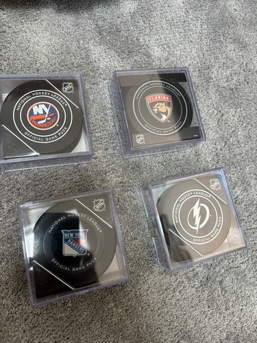 Official nhl game pucks - x,