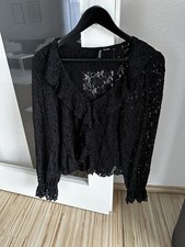 Schwarze Bluse aus Spitzen mit