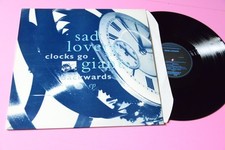 SAD LOVERS AND GIANTS CLOCKS