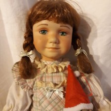 Puppe  mit Schaukelpferd aus