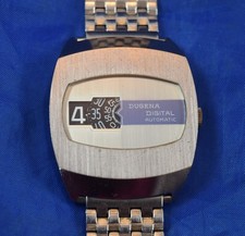Dugena 64  Automatik Digital Armbanduhr Scheibenuhr Vintage 70er Jahre Rar