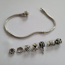 PANDORA Armband 19 cm (*20 cm) mit Zylinderverschluss und 7 Charms 925-Silber