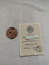 Kampfgruppen der Arbeiterklasse.Schießabzeichen Bronze + Verleihungsurkunde 1964