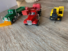 SIKU Schaufelbagger, gelb + 2 LKW von Grell Werbemittel