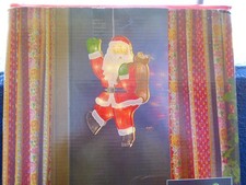 Weihnachtbeleuchtung Weihnachtmann Silhouette beleuchtet Fenster Bild gebraucht