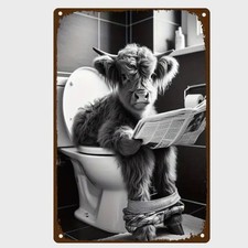 Blechschild Kuh auf Toilette