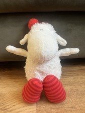 Weißes Schaf mit Zipfelmütze