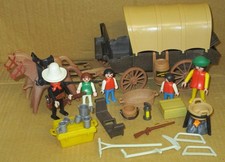 Farmerfamilie mit Planwagen...242