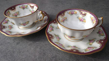 2 Alte zarte Fürstenberg  Mokkatassen, handbemalt. Rote Nummern.
