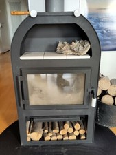 Kaminofen holz gebraucht von Wodtke, in schwarz mit weissen Keramikplatten