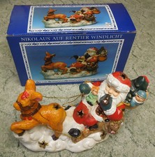 Nikolaus, Weihnachtsmann auf Rentier, Deko Figur Keramik, Windlicht