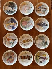 12 Sammelteller mit Modemotiven von Limoges mit Zertifikaten
