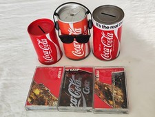 Aus einer Auflösung: 2 Coca Cola Spardosen, 1 Deko Dose und 3 Kassetten