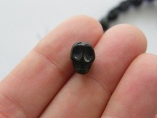 38 schwarze Totenkopf Perlen