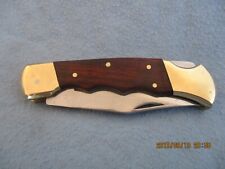 Taschenmesser mit Schließmechanismus Griffschalen sind aus  Messing Holz