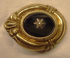 ALTE BROSCHE / ANHÄNGER MIT SCHWARZEM STEIN UND STERN (7)