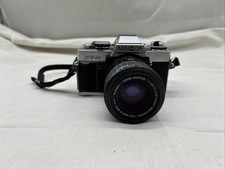 Minolta XG-M Spiegelreflexkamera – Objektiv Sigma Zoom Master 1:2.8-4 f=35 mm 52