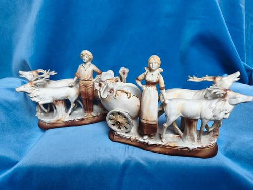 Ein paar porzellanfiguren mit - ein,