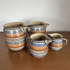Vier Keramik Kannen