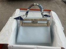 HERMÈS Kelly 25 cm Retourne Handbag in Bleu Brume Swift leather, Full Set