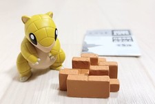 Sandan Versteckspiel Figur
