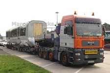 LKW Foto MAN TGA Plattformanhänger Deutschland orange UNIVERSAL TRANSPORT #m3yv