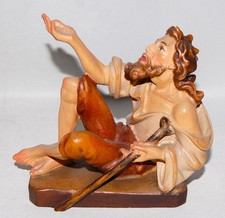 Farbige Holzfigur Bettler für