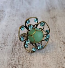 Konplott Ring mittel "Verlorene Unschuld am Gartenzaun" Grün Messing Statement