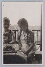 Boy and Girl with Doll -