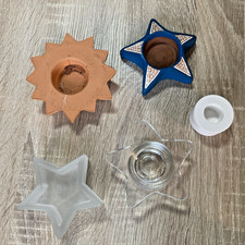 Fünf Kerzenhalter aus Glas