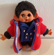 Monchichi Puppe mit Pilotenuniform und Regencape