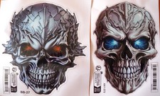 2x 3D- Metalloptik Schädel