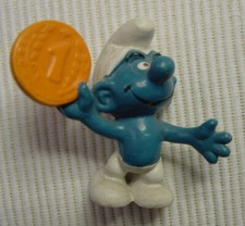 Figur Schlumpf mit Münze
