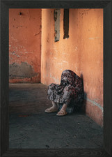 Sitzende Figur in einer