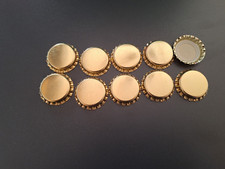 50 unbenutzte Kronkorken gold