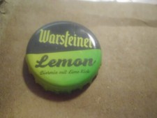 Gebrauchter, grün-grauer Kronkorken Warsteiner Lemon  Biermix mit Lime Kick