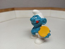 Peyo in arm, Schlumpf mit Keks