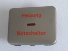 Busch & Jäger alpha nea Wippe in Bronze mit Aufschrift Heizung Notschalter