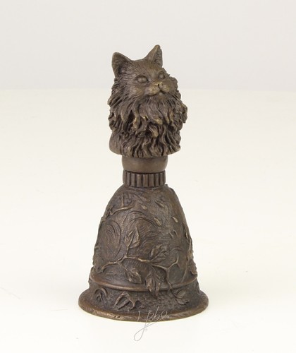 Eine bronzetischglocke mit - eine,