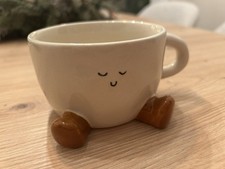 Kaffeetasse mit Lächelndem