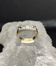 PEQUIGNET - Ring in 750er Gelbgold und Edelstahl besetzt mit 2 Brillanten.