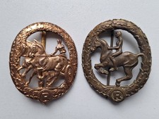 Fahrerabzeichen in Gold und Reiterabzeichen in Bronze