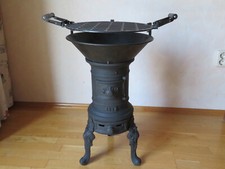 antiken, verzierten gusseisernen Ofen, restauriert mit Grillkombination